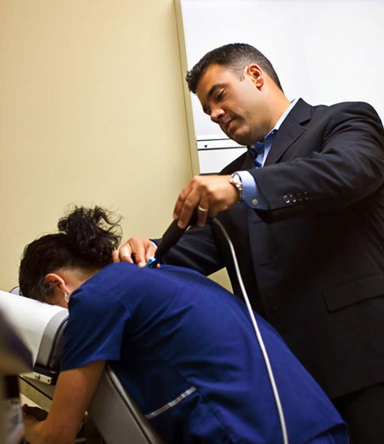 a chiropractor is performing an examination